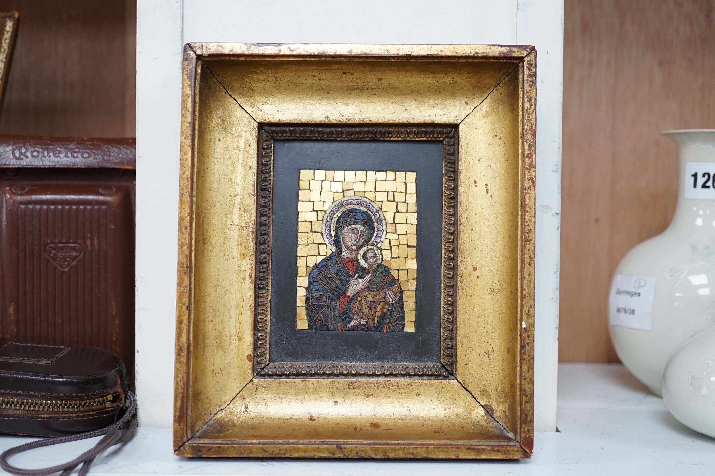 An early 20th century micro mosaic, ‘madonna del perpetuo soccorso’ framed with Vatican label verso, 19x17cm including frame